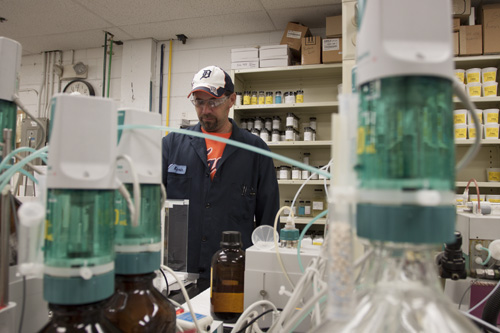 Michigan chemical manufacturing photo example of employee with chemicals in lab