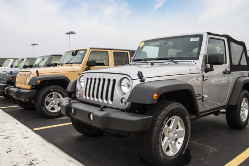 Jeeps parked in an auto dealerships lot in Adrian, Michigan