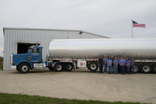 Lenawee Fuels employees line up in front of tanker for website photo shoot