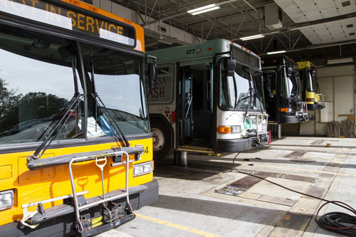 Sun gleams off the windshield of Jackson Michigan Transit Authority busses