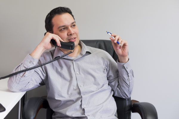 Joe discusses website costs with a potential client.
