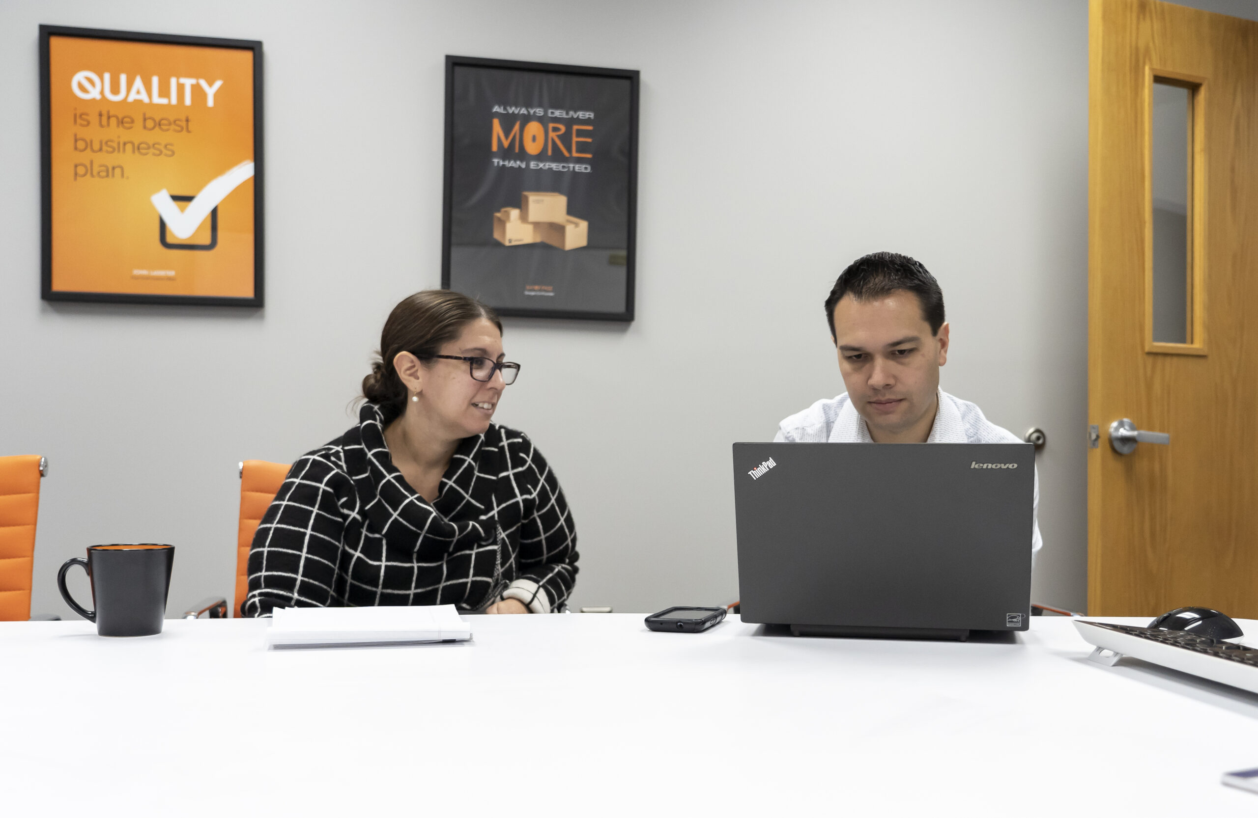 Angela and Joe working together at computer