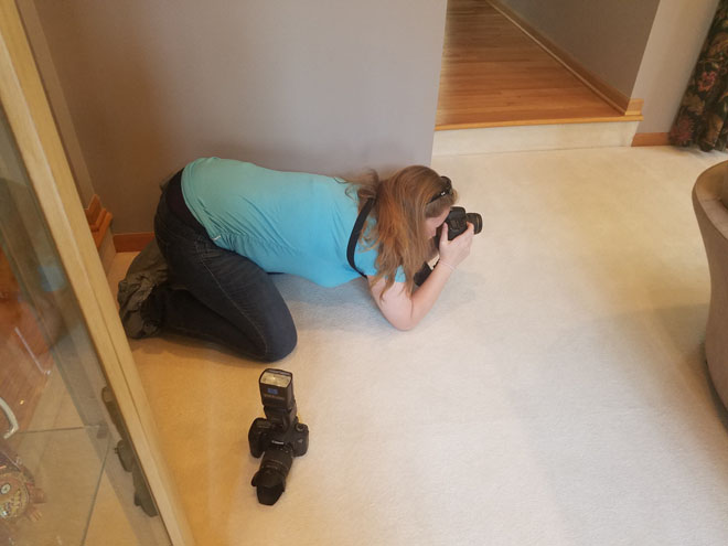 Woman photographer takes photos.
