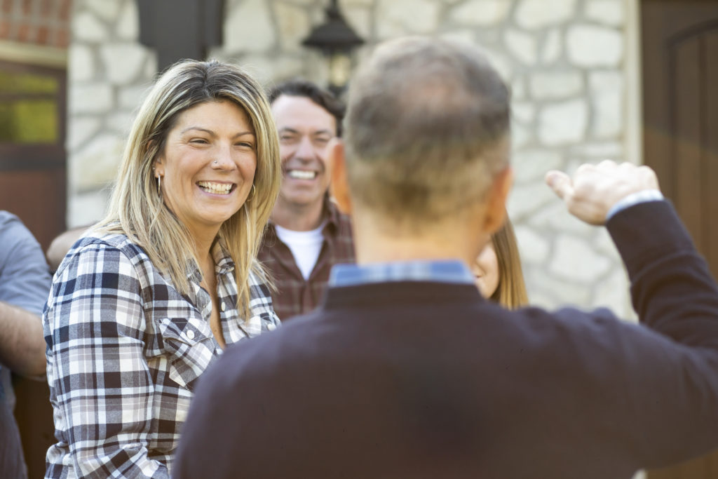 Woman laughs at storytelling website design.