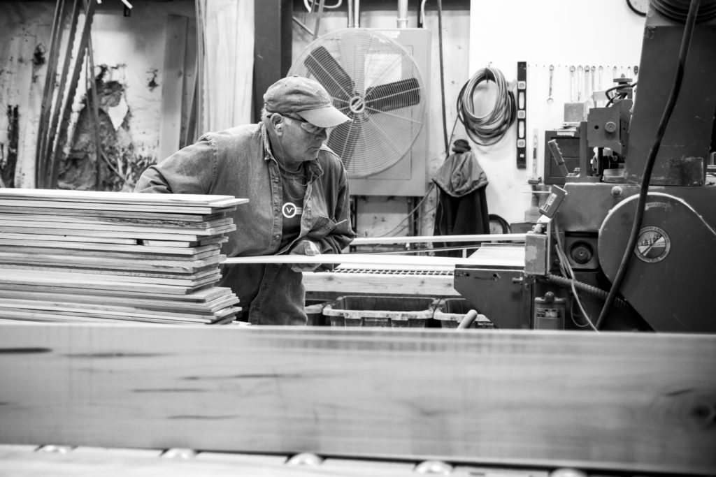Website photography of man in a manufacturing factory. American hardwood flooring manufacturers.