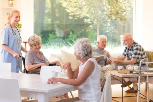 A happy group of seniors in an assisted living community