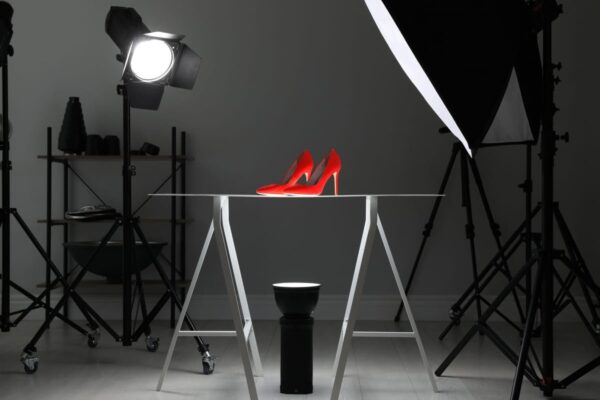 Taking a photography of a pair of red shoes in a professional studio